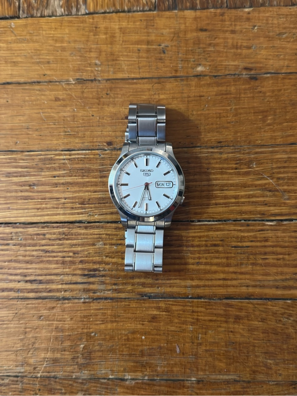 Seiko Silver Men’s Watch with White Dial (SNK789)